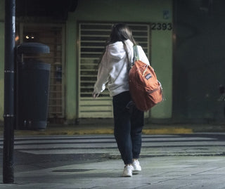 woman walking alone at night